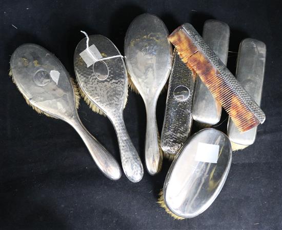 Two silver-mounted part dressing table sets and a clothes brush